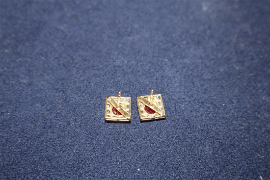 A pair of yellow metal, red stone and rose cut diamond set tablet ear studs.